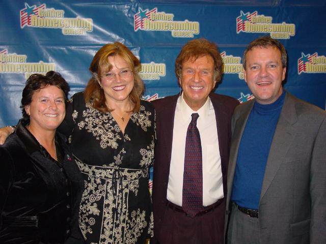 Photo to Right: Marsha Stevens, second from left (an open lesbian who's career is singing Gospel music) with her wife, Cindy. The man to the right of Marsha is Southern Gospel Music legend, Bill Gaither. Marsha had just performed on the show at a Gaither Homecoming concert. Far right is Mark Lowry. 