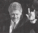Clinton makes the devil sign