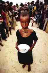 child holding empty food bowl